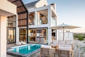 an image of a house with a pool at Thalassophile Beach House - Heated Pool in St. Helena Bay