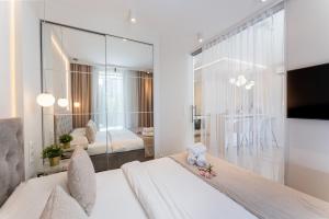 Posteľ alebo postele v izbe v ubytovaní Ga Luxury Apartments M54