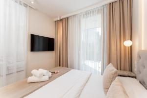 Posteľ alebo postele v izbe v ubytovaní Ga Luxury Apartments M54