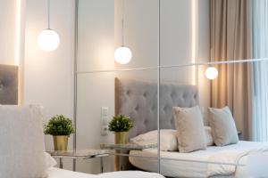 Posteľ alebo postele v izbe v ubytovaní Ga Luxury Apartments M54