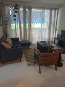 a living room with a couch and chairs and a table at royal at courtleigh towers in Kingston