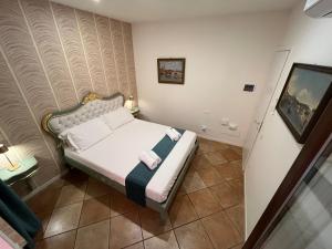 Postel nebo postele na pokoji v ubytování Residenza Catullo