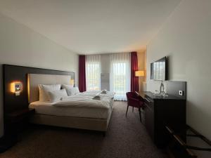 Postel nebo postele na pokoji v ubytování Fontane Hotel