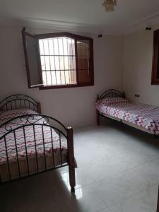 Postel nebo postele na pokoji v ubytování Villa Française à Saidia Dallas + 7 fotografií