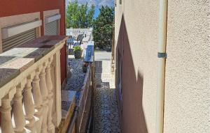 an alley between a building and a wall at Holiday Home Podgorska V in Senj
