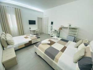 Postel nebo postele na pokoji v ubytování Sicilian Rooms
