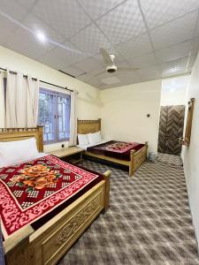 Postel nebo postele na pokoji v ubytování MANOKUR - E- BASA HOTEl + 20 fotografií