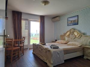 Postel nebo postele na pokoji v ubytování Guest House Vila Luka