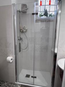 a shower with a glass door in a bathroom at La Cantina Guest House in Bisceglie +25 photos