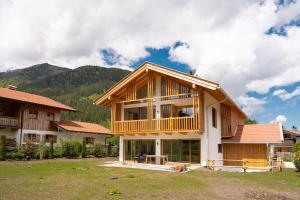 a house being constructed with a wooden roof at Bergblick Chalet in Bayrischzell