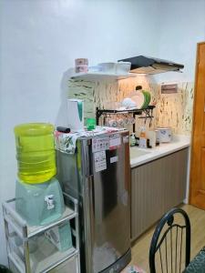 a kitchen with a small refrigerator and a counter at CJ’sstaycation in Lapu Lapu in Maribago