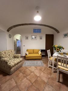 a living room with a couch and a table at Casa Ami in Bordighera