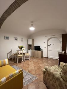 a living room with a couch and a table at Casa Ami in Bordighera