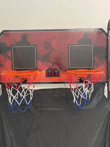a basketball hoop with a net in a gym at 5 Minutes to Rye beach in Rye