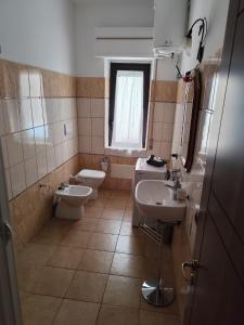 Koupelna v ubytování Reggio'S House