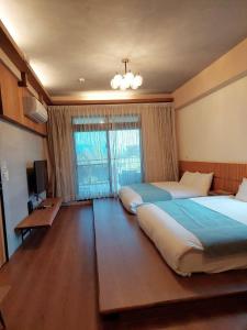 Postel nebo postele na pokoji v ubytování Jiaoxi Pusu Homestay