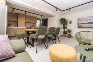 a living room with a table and chairs at Marina Beach 38 Denia in Denia