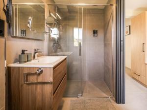 a bathroom with a sink and a shower at Marina Beach 38 Denia in Denia +67 photos