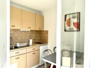 A kitchen or kitchenette at Beach Cannes Bungalows