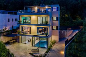 an aerial view of a house at night at Villa Lamia Opatija by Kvarner Rentals in Opric