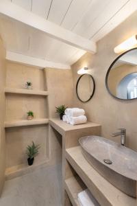 a bathroom with a sink and a mirror at 3-4 Bedrooms Villa in old Town in Rhodes Town
