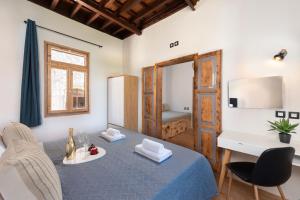 a living room with a table and a desk at 3-4 Bedrooms Villa in old Town in Rhodes Town