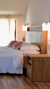 Postel nebo postele na pokoji v ubytování Mimi Boutique Farm Stay & Cuisine