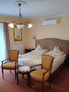 Giường trong phòng chung tại Melinda Villa