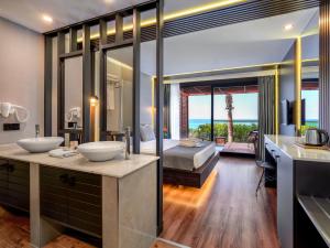 A bed or beds in a room at Adora Calma Beach Hotel Adults Only