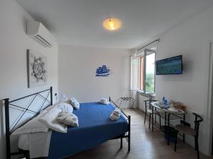 Postel nebo postele na pokoji v ubytování Affittacamere Il Veliero
