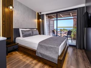 Postel nebo postele na pokoji v ubytování Adora Calma Beach Hotel Adults Only + 37 fotografií