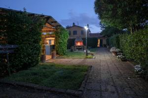 a house with a lit up yard at night at Agriturismo Niccoland in Grosseto