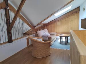 a living room with a couch and a table at Magnifique Appartement le Nid des Thermes in Bagnères-de-Bigorre