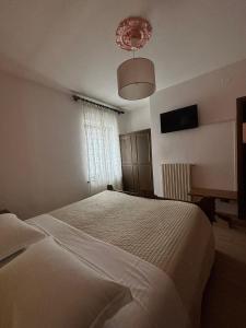 Postel nebo postele na pokoji v ubytování Hotel Miravalle