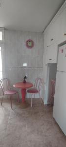 a room with a table and chairs and a red table at Nuria's home in Calanda +28 photos