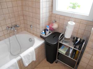 a bathroom with a bath tub and a sink at Apartment Ana in Zadar