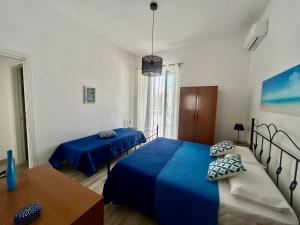Postel nebo postele na pokoji v ubytování Casa vacanze Nina