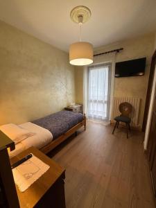 Postel nebo postele na pokoji v ubytování Hotel Miravalle