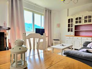 a living room with a couch and a table at ALBAREÍLLA by #cherrygredos in El Arenal