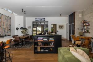 a living room with a couch and a table at Zen House in Zadar