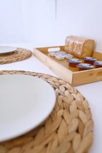 a table with a basket and a tray of soap at Panorama View Kanala in Kithnos