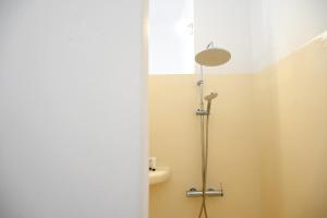 a bathroom with a shower and a sink at Panorama View Kanala in Kithnos