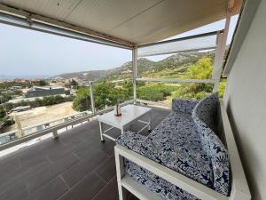 a bedroom with a bed and a table on a balcony at Dela in Hvar
