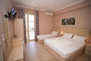 Postel nebo postele na pokoji v ubytování Hotel Kojku