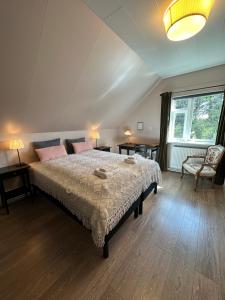 Postel nebo postele na pokoji v ubytování Helluland Guesthouse
