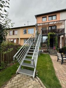 a set of stairs in front of a house at Apartman Ala in Poprad