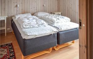two twin beds in a room with at Hytte 1 in Øvre Ramse