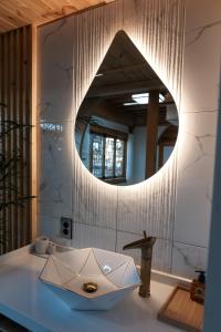 a bathroom with a sink and a mirror at 경주 황리단길 한옥스테이 다가감 in Gyeongju +60 photos