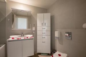 a bathroom with a sink and a mirror at Bw Lux Apartments - Beograd na Vodi in Belgrade +37 photos