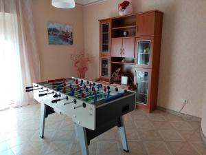 a living room with a foosball table in a room at La Perla dei Templi in Agrigento